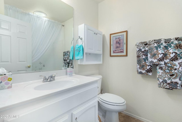 bathroom with vanity and toilet