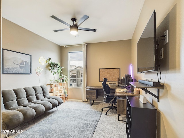 carpeted office with ceiling fan