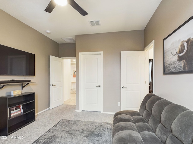 living room featuring ceiling fan and carpet flooring