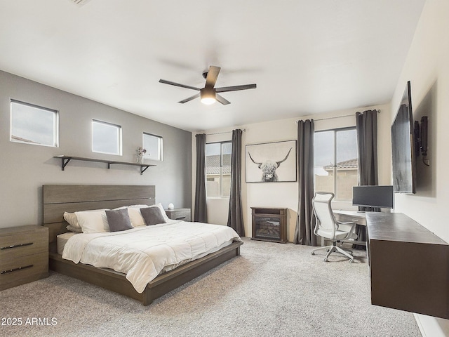 carpeted bedroom with ceiling fan