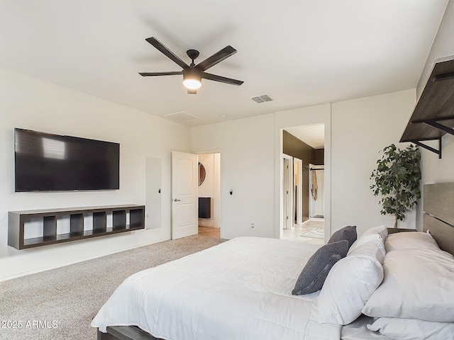 bedroom featuring light carpet and ceiling fan