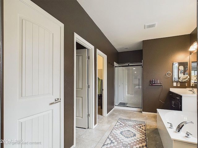 bathroom featuring vanity, separate shower and tub, and tile patterned flooring