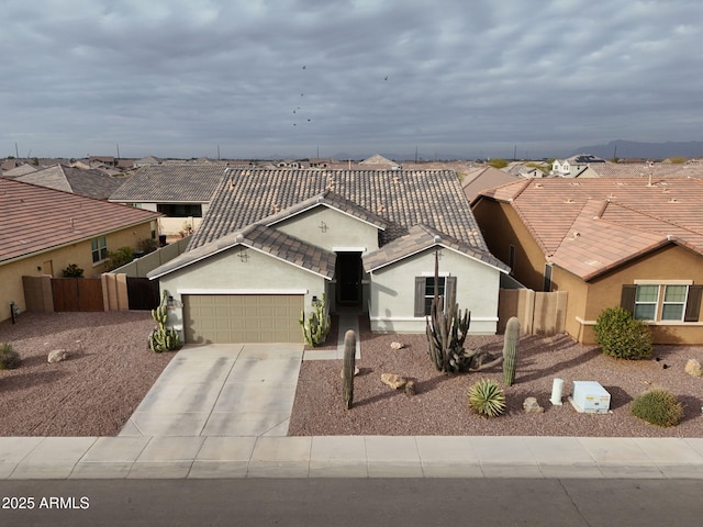 ranch-style home featuring a garage