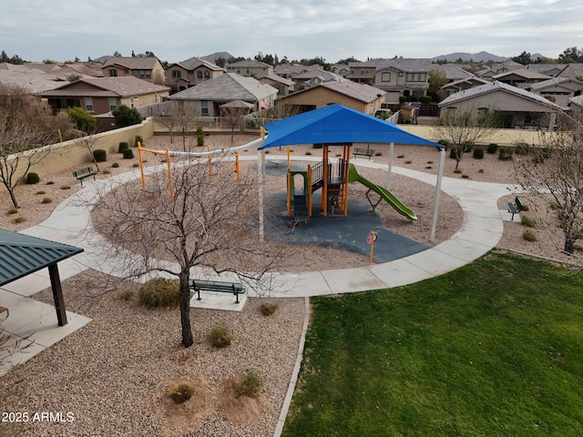 view of property's community featuring a playground