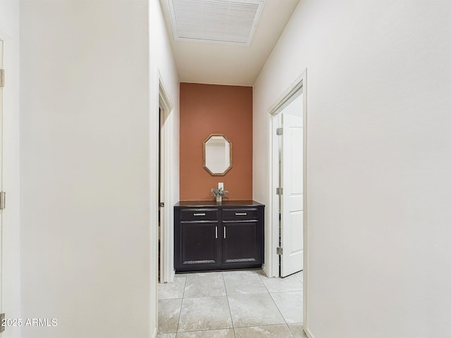 hallway featuring light tile patterned floors