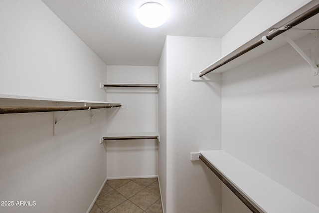 walk in closet featuring light tile patterned floors