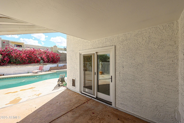 view of patio / terrace featuring a fenced in pool