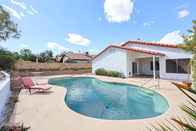 view of swimming pool with a patio area, a fenced in pool, and a fenced backyard