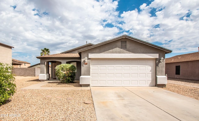 ranch-style home with a garage