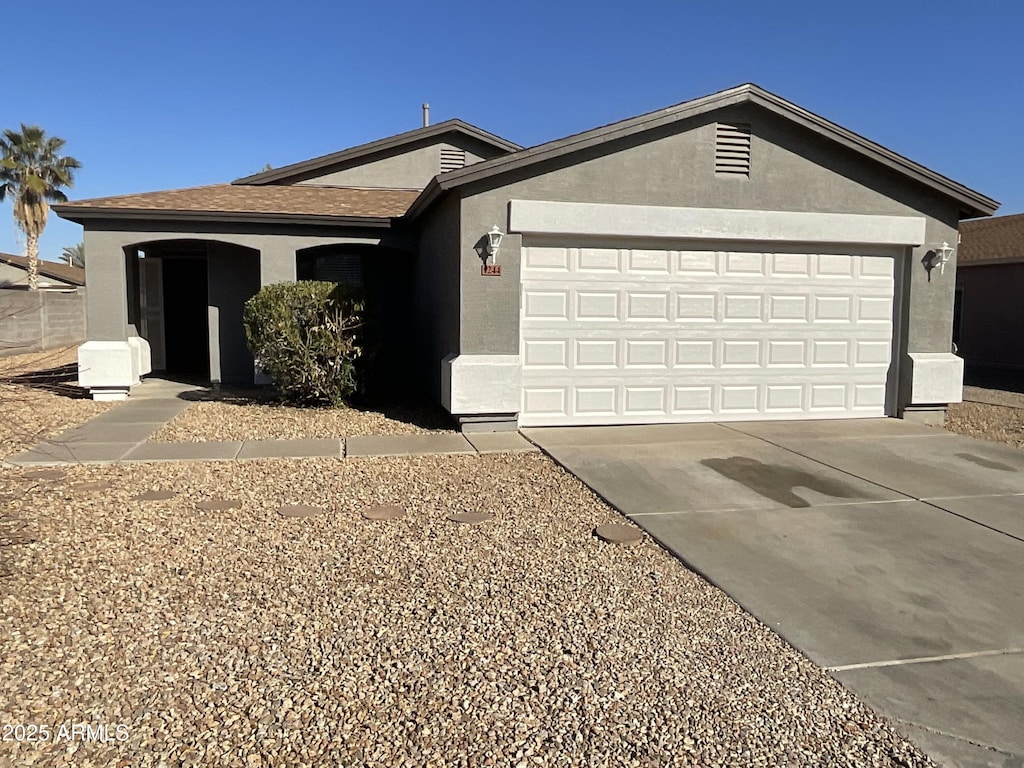 ranch-style home with a garage