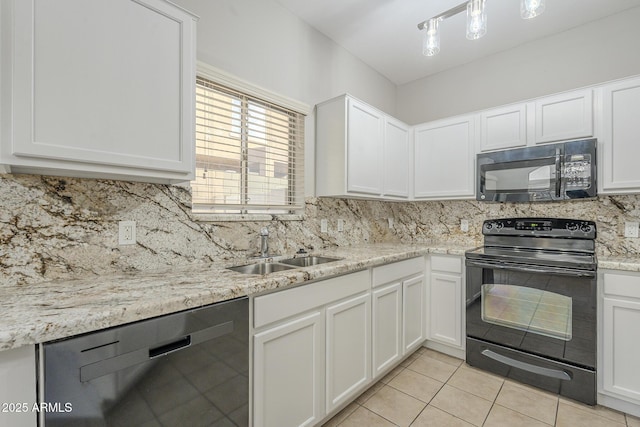 kitchen featuring sink, white cabinets, and black appliances