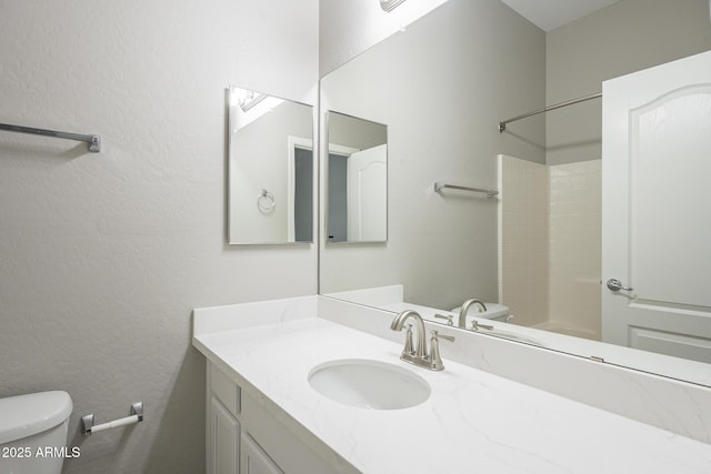 full bathroom with vanity, shower / bathtub combination, and toilet