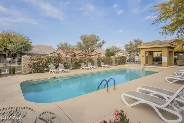 view of swimming pool with a patio