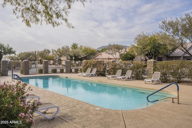 view of swimming pool with a patio