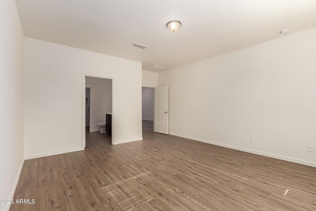 unfurnished room featuring dark hardwood / wood-style floors