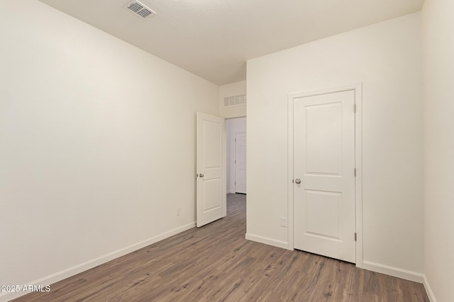 unfurnished bedroom featuring wood-type flooring