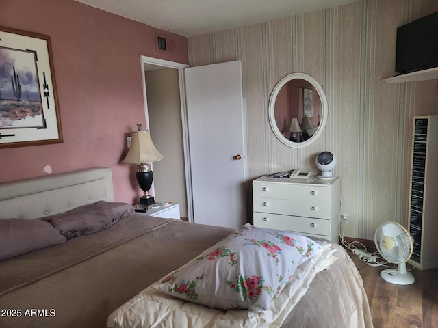 bedroom featuring hardwood / wood-style floors