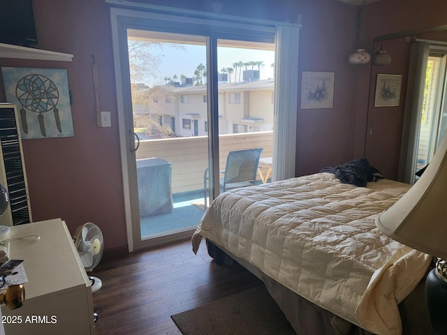 bedroom featuring dark hardwood / wood-style floors and access to outside