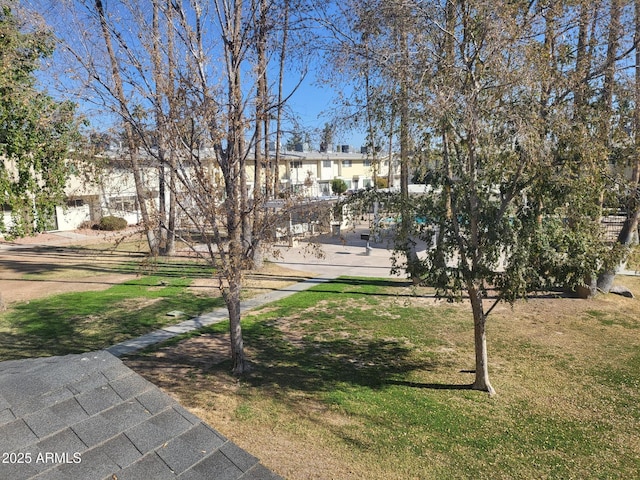 view of property's community with a yard