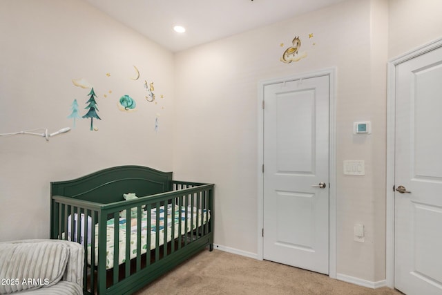 2631 S Sulley Dr Unit 106, Gilbert, AZ 85295 - bedroom featuring carpet, baseboards, and a crib