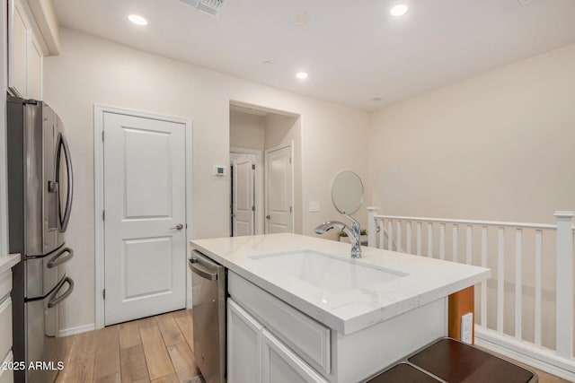 2631 S Sulley Dr Unit 106, Gilbert, AZ 85295 - bathroom with wood finished floors, vanity, recessed lighting, and baseboards