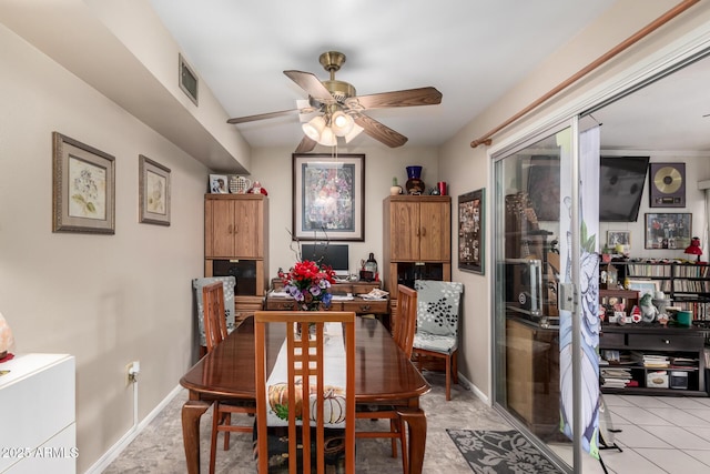 dining area featuring ceiling fan and light tile patterned floors