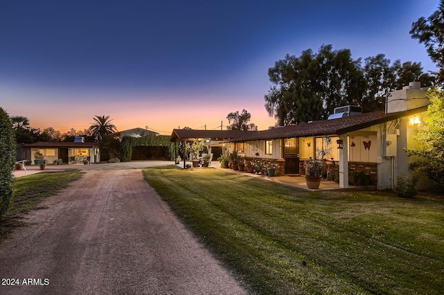 view of front of property with a lawn