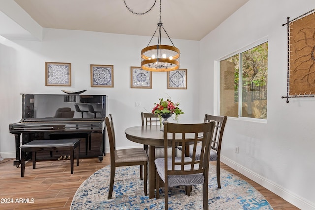 dining room featuring an inviting chandelier and wood-type flooring