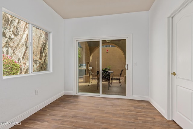 unfurnished room featuring light hardwood / wood-style floors