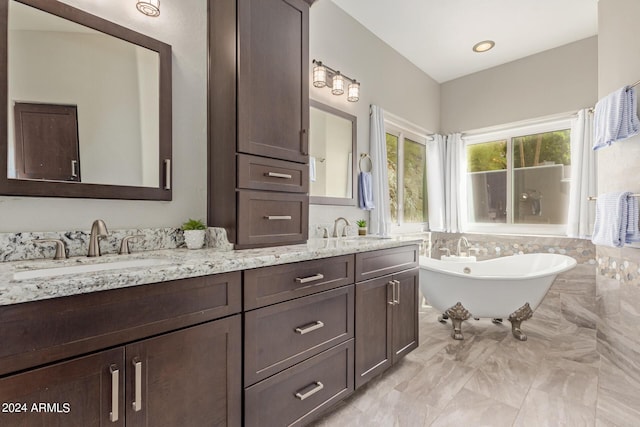 bathroom featuring vanity and a bathing tub