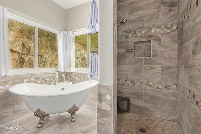 bathroom with a tub to relax in