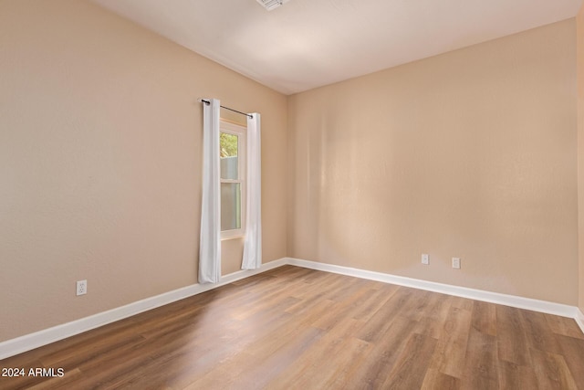 spare room featuring hardwood / wood-style floors