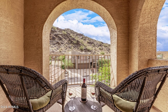 balcony featuring a mountain view