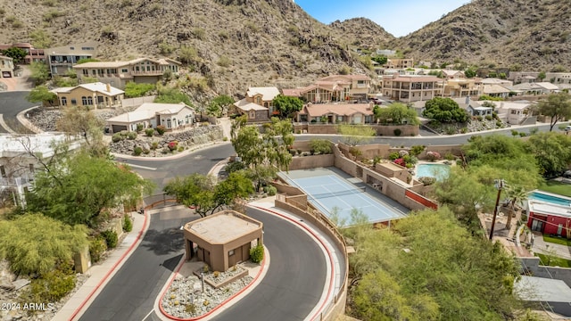 birds eye view of property featuring a mountain view