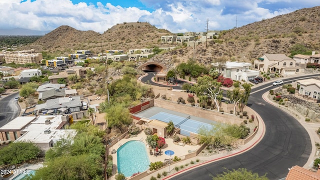 birds eye view of property with a mountain view