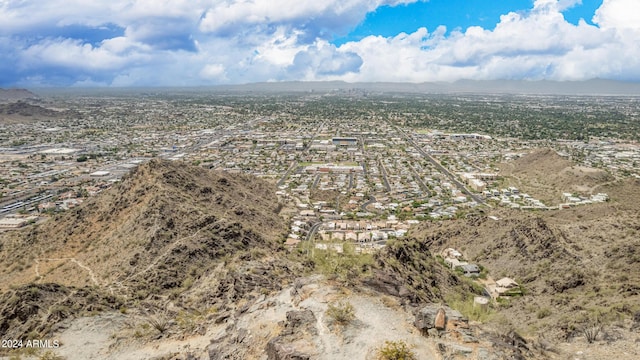 birds eye view of property with a mountain view