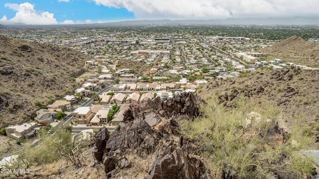 birds eye view of property featuring a mountain view