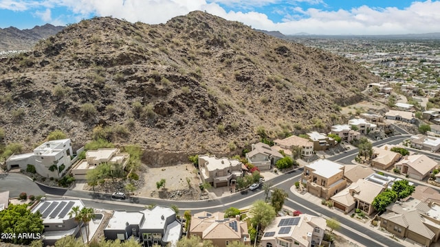 birds eye view of property featuring a mountain view