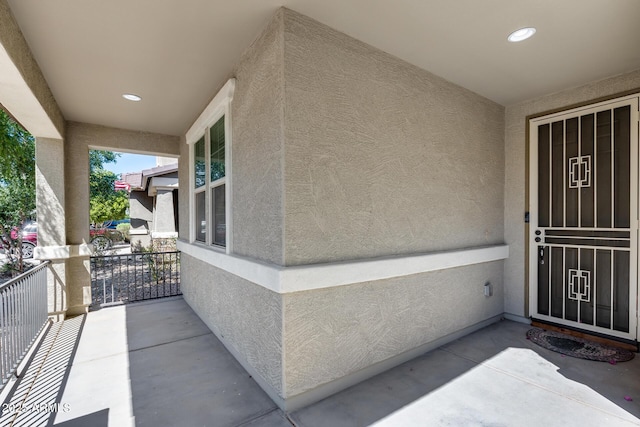 view of exterior entry with stucco siding