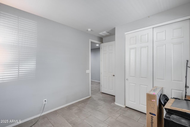 unfurnished office with baseboards
