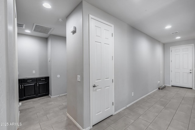 hall with visible vents and recessed lighting