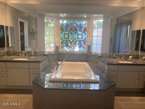 bathroom with sink and crown molding