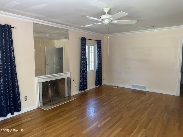 unfurnished living room featuring hardwood / wood-style flooring, crown molding, and ceiling fan