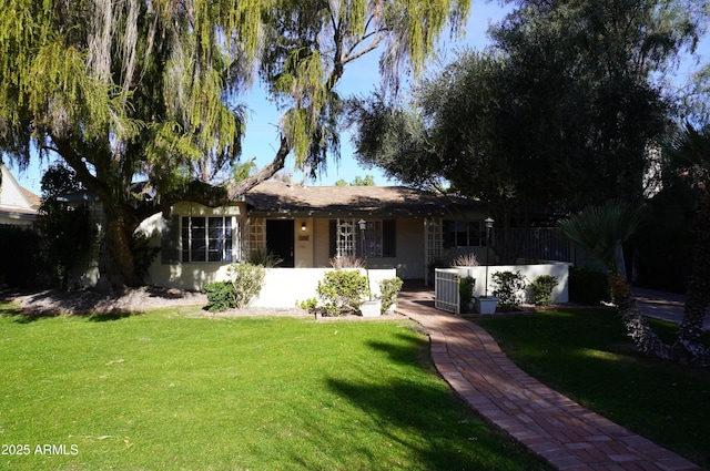 ranch-style house with a front yard