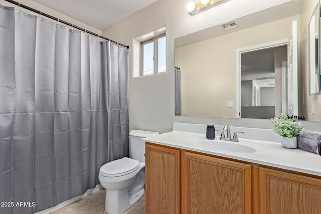 bathroom featuring tile patterned flooring, a shower with curtain, vanity, and toilet