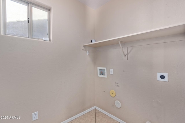 washroom with hookup for an electric dryer, light tile patterned floors, hookup for a gas dryer, and washer hookup