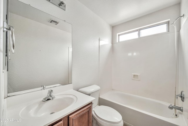 bathroom with  shower combination, visible vents, vanity, and toilet