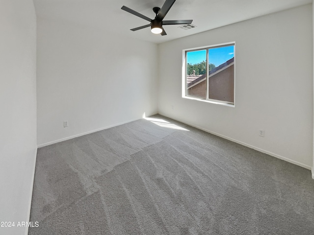 carpeted empty room with ceiling fan