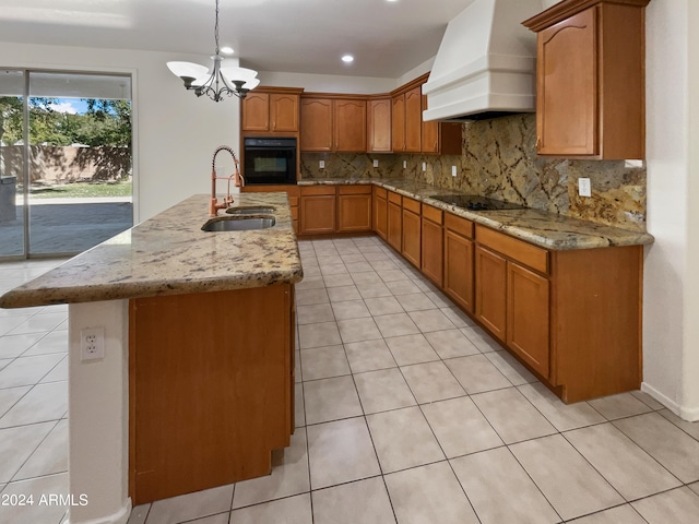 kitchen featuring black appliances, sink, hanging light fixtures, custom exhaust hood, and backsplash