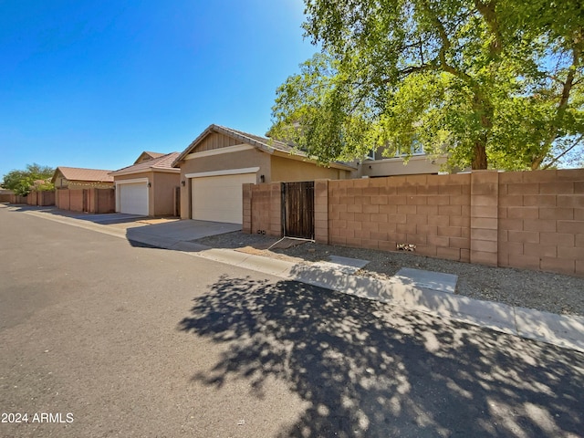 ranch-style home featuring a garage